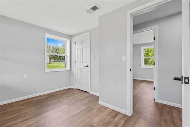 812 W Royle St, Richmond, MO 64085 - unfurnished bedroom with wood finished floors and baseboards