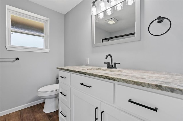 812 W Royle St, Richmond, MO 64085 - bathroom with vanity and wood finished floors