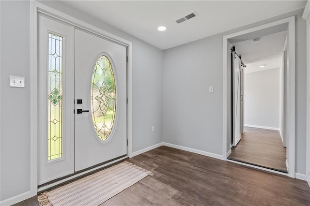 812 W Royle St, Richmond, MO 64085 - foyer entrance featuring dark wood-type flooring and a barn door