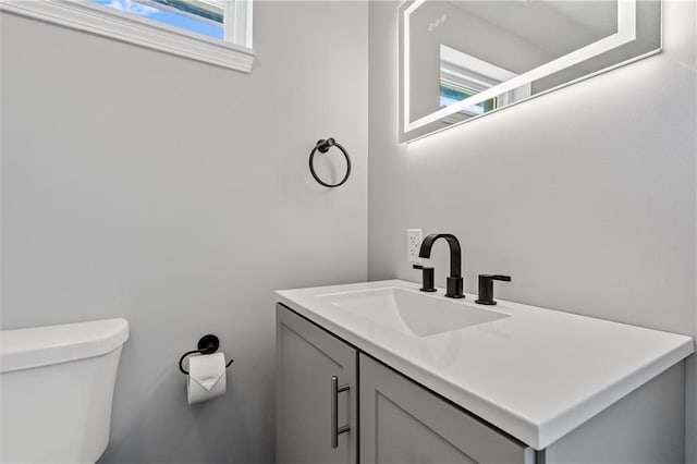812 W Royle St, Richmond, MO 64085 - half bath featuring vanity and healthy amount of natural light