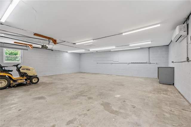 812 W Royle St, Richmond, MO 64085 - garage with a wall mounted air conditioner and concrete block wall
