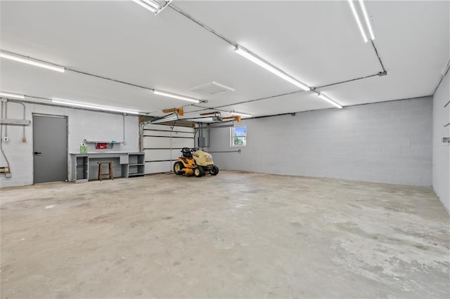 812 W Royle St, Richmond, MO 64085 - garage featuring concrete block wall