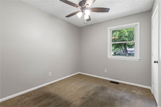 1138 S Willow St, Ottawa, KS 66067 - empty room featuring ceiling fan, carpet, and a textured ceiling