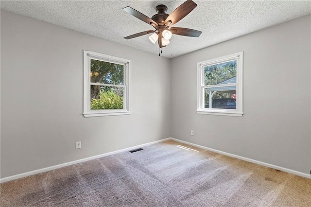 1138 S Willow St, Ottawa, KS 66067 - carpeted spare room featuring ceiling fan and a textured ceiling