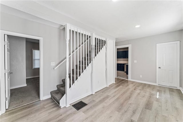 4320 E 43rd St, Kansas City, MO 64130 - stairs with wood finished floors and recessed lighting