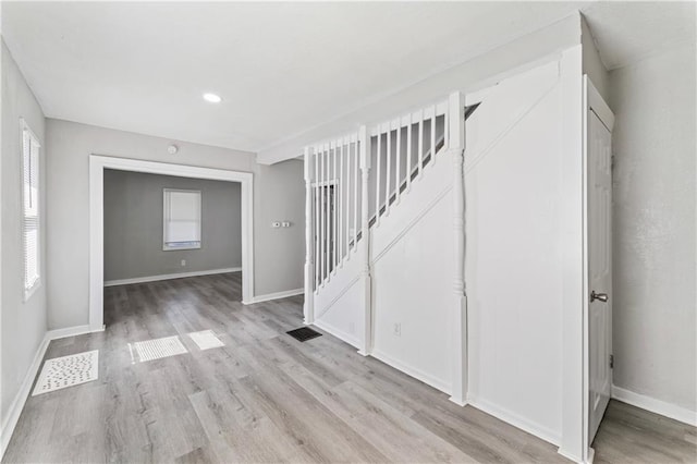 4320 E 43rd St, Kansas City, MO 64130 - entrance foyer featuring light wood-style floors, stairs, and recessed lighting