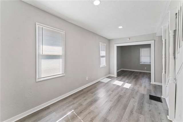 4320 E 43rd St, Kansas City, MO 64130 - spare room with wood finished floors and recessed lighting
