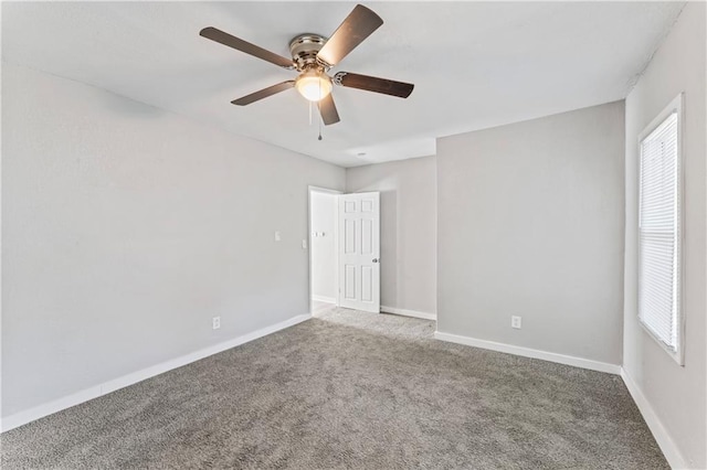 4320 E 43rd St, Kansas City, MO 64130 - carpeted spare room with ceiling fan and plenty of natural light