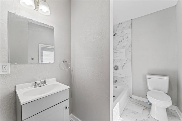 4320 E 43rd St, Kansas City, MO 64130 - full bath with marble finish floors, vanity, and shower / washtub combination