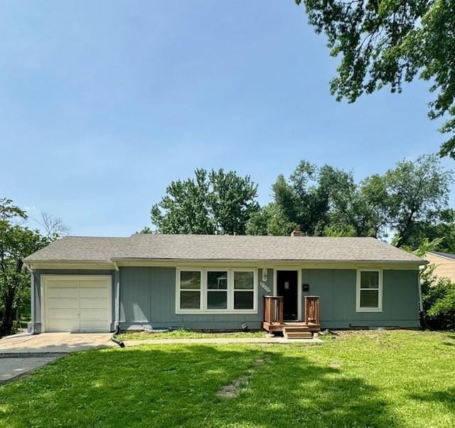 6300 E 149th St, Grandview, MO 64030 - ranch-style house featuring a garage, a front lawn, and driveway