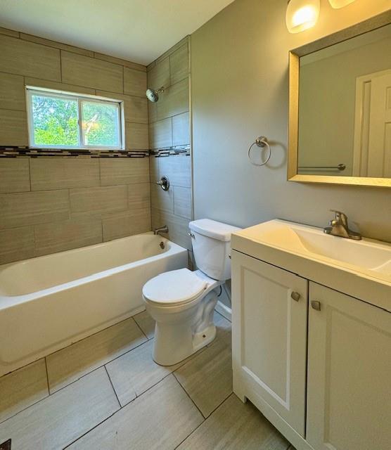 6300 E 149th St, Grandview, MO 64030 - bathroom featuring vanity,  shower combination, and tile patterned flooring