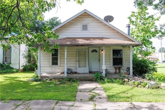 919 Indiana St, Neodesha, KS 66757 - bungalow-style house featuring a porch and a front yard