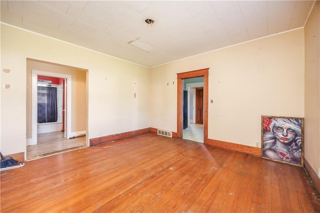 919 Indiana St, Neodesha, KS 66757 - spare room with hardwood / wood-style flooring and baseboards