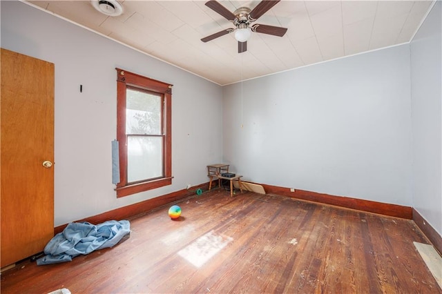 919 Indiana St, Neodesha, KS 66757 - unfurnished room featuring wood-type flooring and ceiling fan