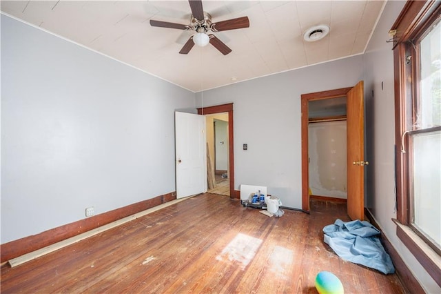 919 Indiana St, Neodesha, KS 66757 - unfurnished bedroom featuring wood finished floors and ceiling fan