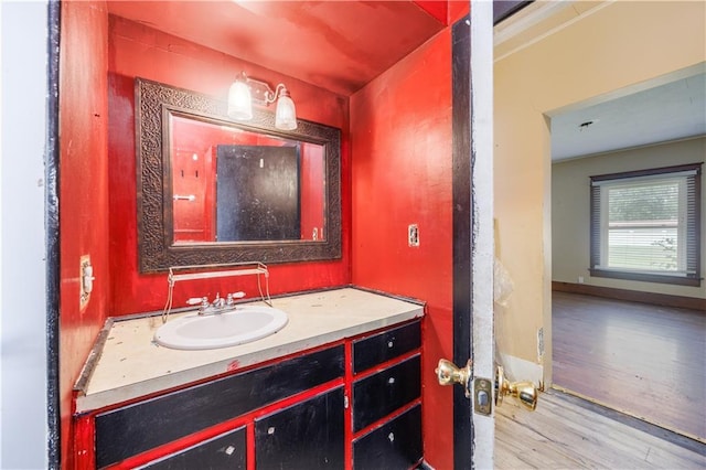 919 Indiana St, Neodesha, KS 66757 - bathroom featuring wood finished floors and vanity