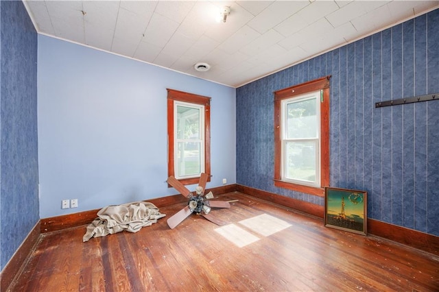 919 Indiana St, Neodesha, KS 66757 - empty room with hardwood / wood-style floors and crown molding