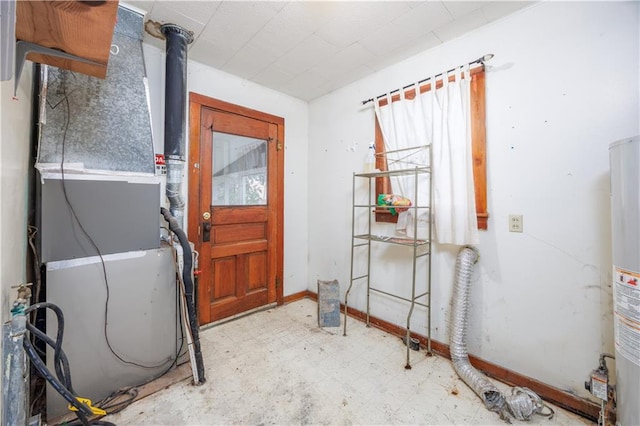 919 Indiana St, Neodesha, KS 66757 - interior space with tile patterned floors, heating unit, and water heater