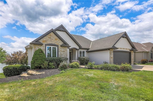 129 SE Chelsea Dr, Lees Summit, MO 64063 - french provincial home with stone siding, a front yard, a garage, driveway, and stucco siding