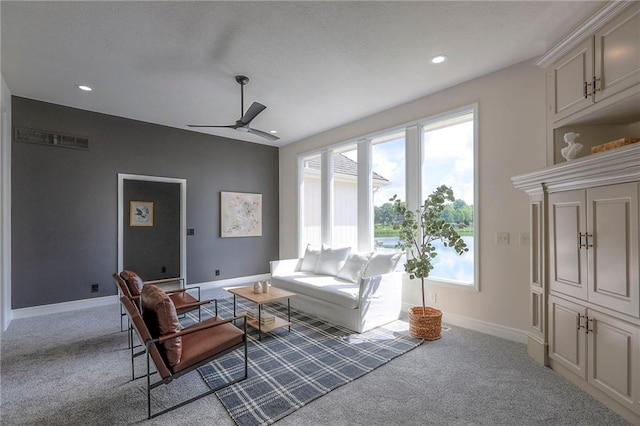 129 SE Chelsea Dr, Lees Summit, MO 64063 - carpeted living room with ceiling fan and recessed lighting