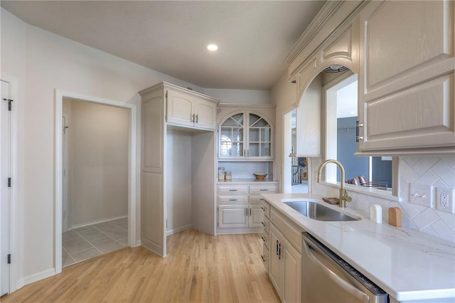 129 SE Chelsea Dr, Lees Summit, MO 64063 - kitchen with dishwasher, tasteful backsplash, light wood finished floors, recessed lighting, and glass insert cabinets