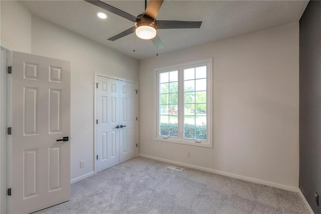 129 SE Chelsea Dr, Lees Summit, MO 64063 - unfurnished bedroom featuring carpet floors, recessed lighting, a closet, and a ceiling fan
