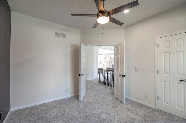 129 SE Chelsea Dr, Lees Summit, MO 64063 - unfurnished bedroom with light carpet, recessed lighting, and a ceiling fan