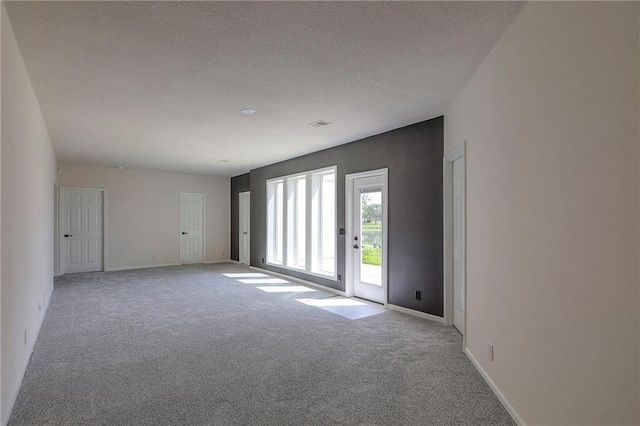 129 SE Chelsea Dr, Lees Summit, MO 64063 - unfurnished room featuring light colored carpet and a textured ceiling