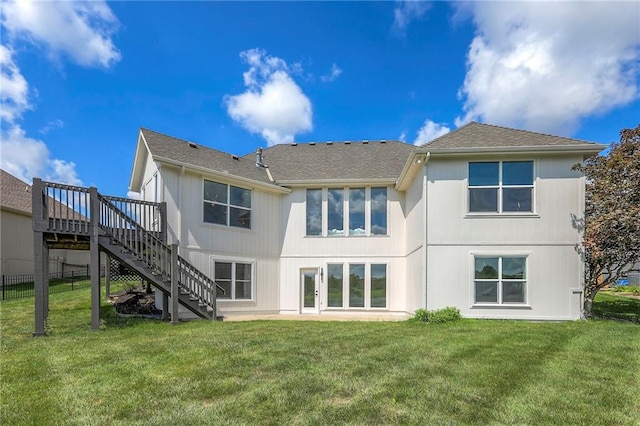 129 SE Chelsea Dr, Lees Summit, MO 64063 - back of house with stairway, a wooden deck, and roof with shingles