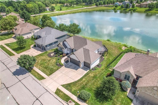 129 SE Chelsea Dr, Lees Summit, MO 64063 - aerial view of residential area featuring a nearby body of water