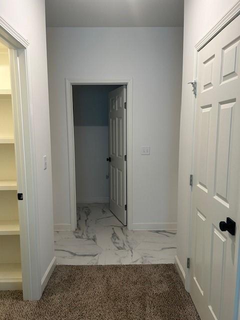 211 Harrison St, Pomona, KS 66076 - hallway featuring baseboards and marble look tiles