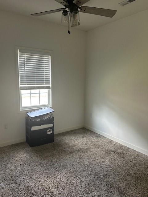 211 Harrison St, Pomona, KS 66076 - carpeted spare room with ceiling fan and baseboards