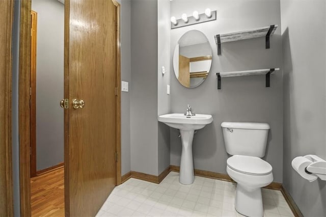 3605 NW Pier Ct, Blue Springs, MO 64015 - bathroom with toilet and baseboards