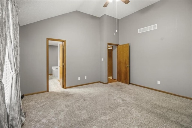 3605 NW Pier Ct, Blue Springs, MO 64015 - unfurnished bedroom with light carpet, high vaulted ceiling, ceiling fan, and connected bathroom
