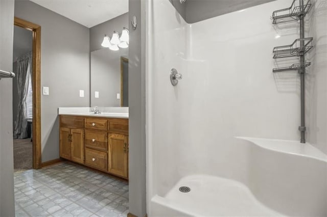 3605 NW Pier Ct, Blue Springs, MO 64015 - bathroom with vanity, a shower, and tile patterned floors