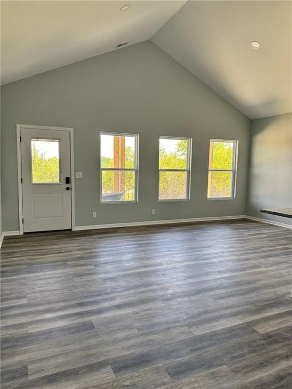 213 Bald Eagle Dr, La Cygne, KS 66040 - unfurnished living room featuring plenty of natural light, dark wood-style flooring, recessed lighting, and high vaulted ceiling