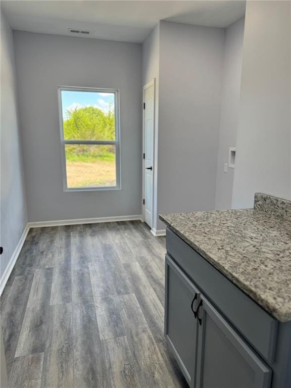213 Bald Eagle Dr, La Cygne, KS 66040 - unfurnished dining area with wood finished floors and baseboards