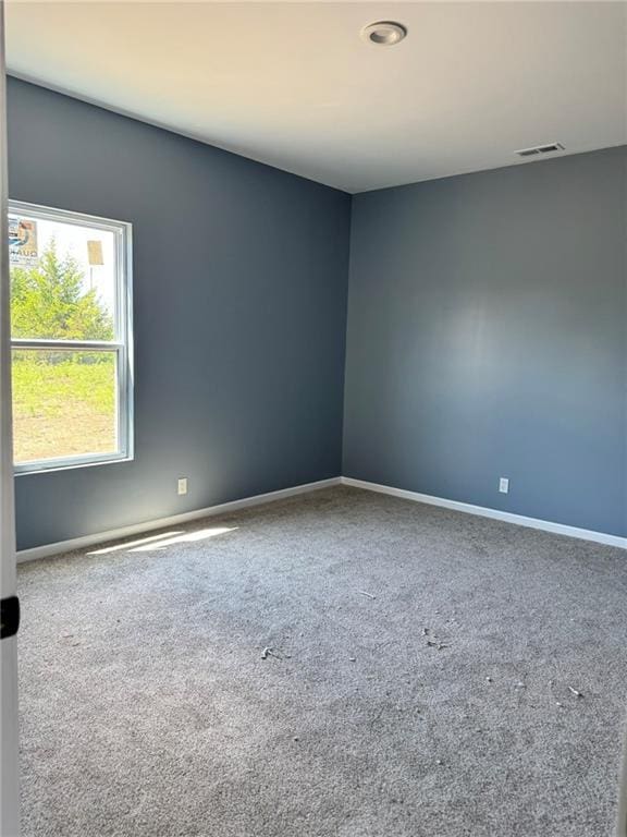 213 Bald Eagle Dr, La Cygne, KS 66040 - carpeted empty room featuring baseboards