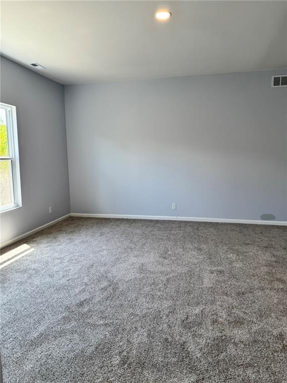 213 Bald Eagle Dr, La Cygne, KS 66040 - empty room featuring carpet and recessed lighting