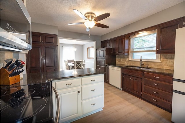 1604 SW 21st St, Blue Springs, MO 64015 - kitchen featuring white appliances, ceiling fan, white cabinetry, light wood finished floors, and tasteful backsplash