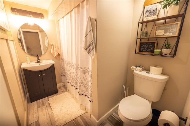 1604 SW 21st St, Blue Springs, MO 64015 - full bathroom featuring wood finished floors, vanity, and a shower with curtain