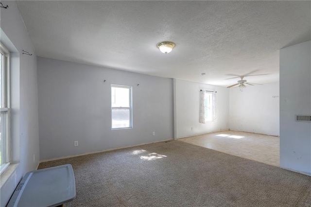 934 Williams St, Excelsior Springs, MO 64024 - carpeted spare room featuring a ceiling fan and a textured ceiling