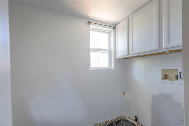 934 Williams St, Excelsior Springs, MO 64024 - washroom with hookup for a washing machine, cabinet space, and a textured ceiling