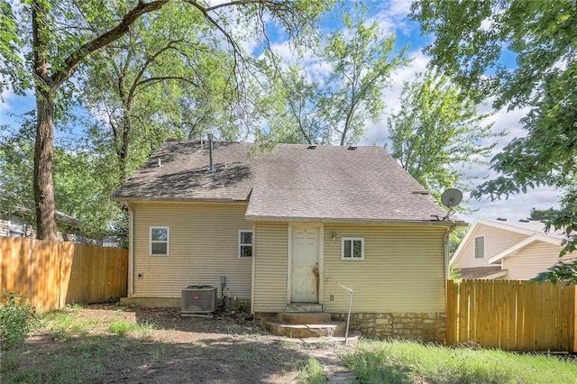 934 Williams St, Excelsior Springs, MO 64024 - back of house with entry steps and a shingled roof