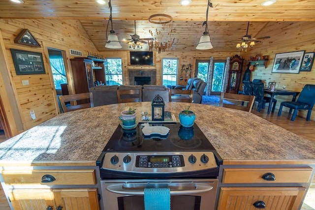 28909 E 297th St, Garden City, MO 64747 - kitchen featuring electric range, wooden walls, wooden ceiling, ceiling fan, and vaulted ceiling