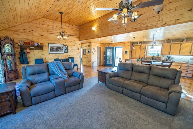 28909 E 297th St, Garden City, MO 64747 - carpeted living area featuring ceiling fan, wooden walls, vaulted ceiling, and wood ceiling