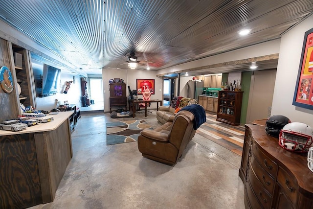 28909 E 297th St, Garden City, MO 64747 - living area with concrete floors and a ceiling fan