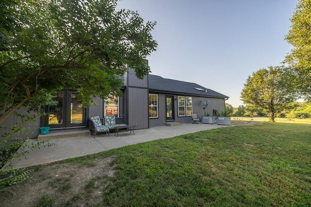 28909 E 297th St, Garden City, MO 64747 - rear view of house with a patio area and a lawn