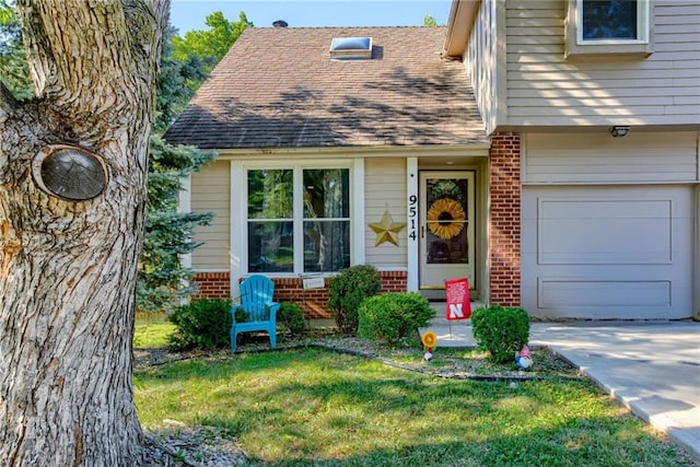 9514 W 77th Ter, Overland Park, KS 66204 - view of front of home featuring brick siding, a shingled roof, a garage, driveway, and a front yard