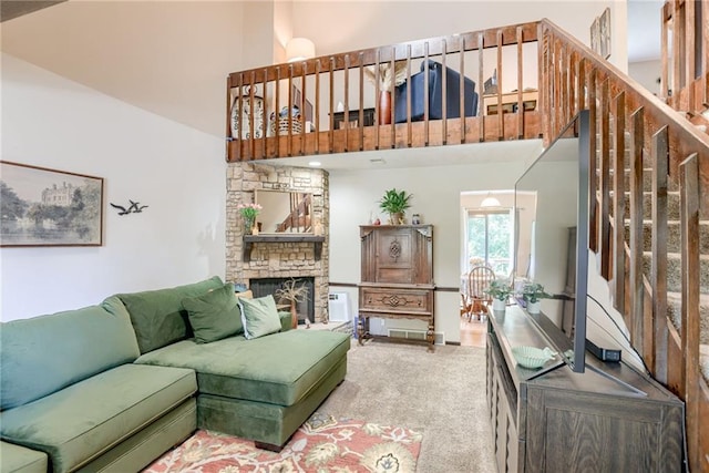 9514 W 77th Ter, Overland Park, KS 66204 - carpeted living area with a towering ceiling, a fireplace, and stairway